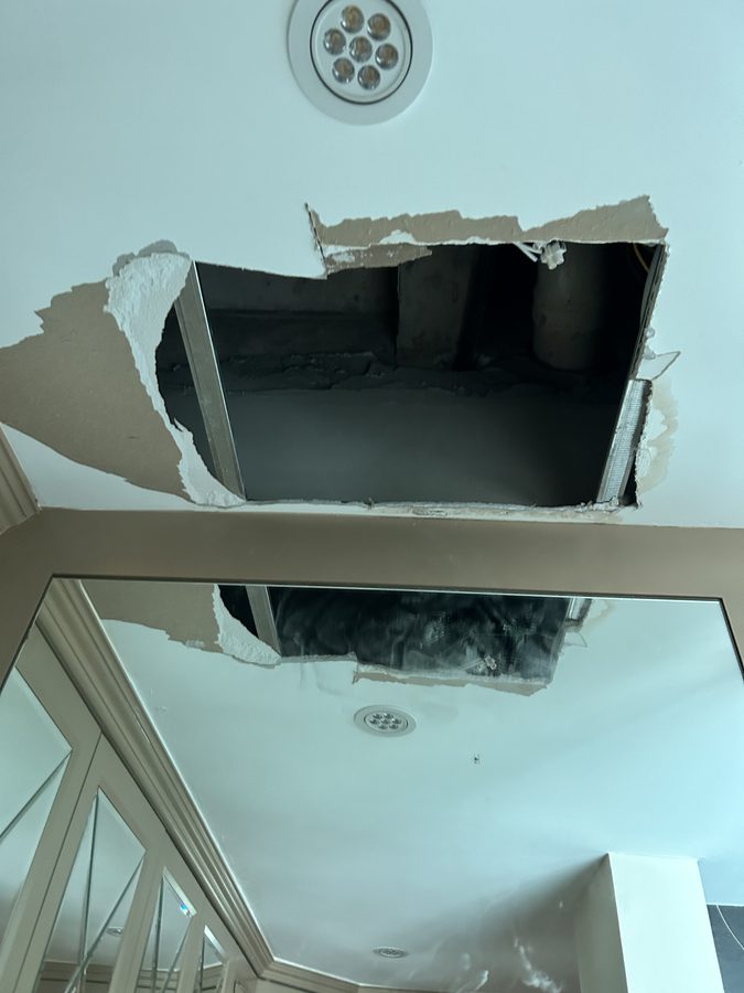 A hole that opened up in the ceiling. This sort of thing does happen.
