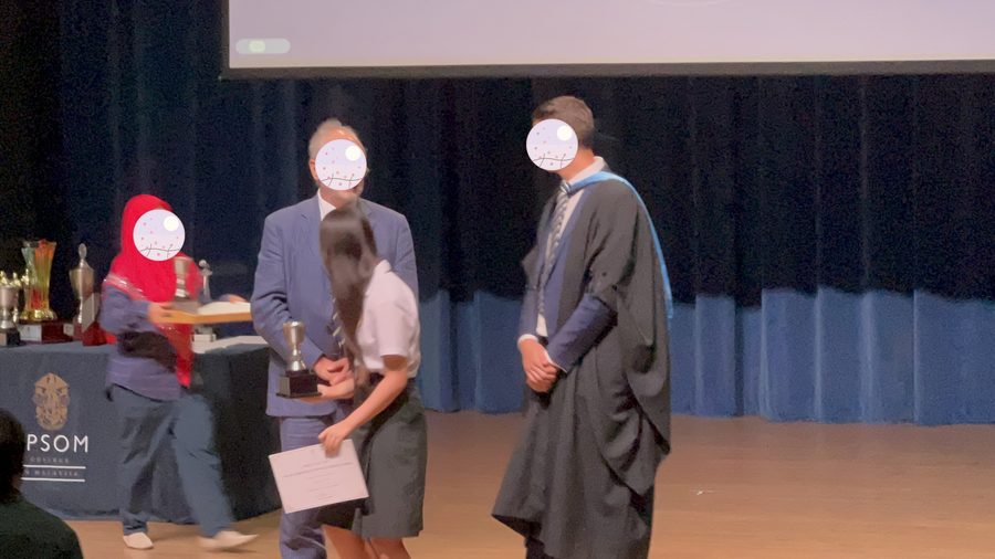 After the ceremony, certificate in hand.