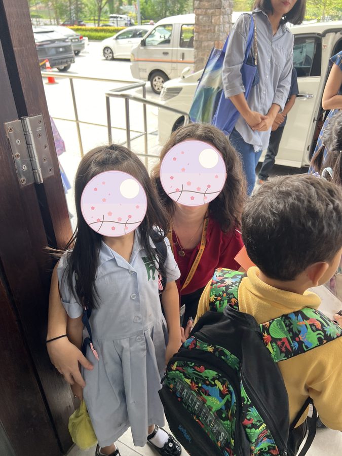 With a classmate. The nationalities are just as mixed here.