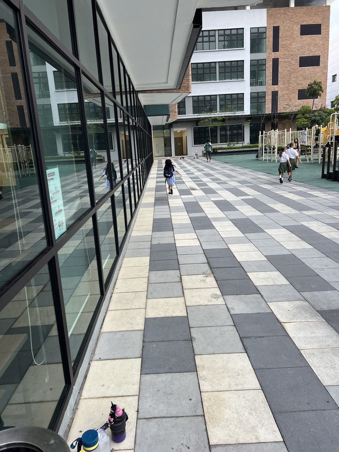 The walkway between buildings.