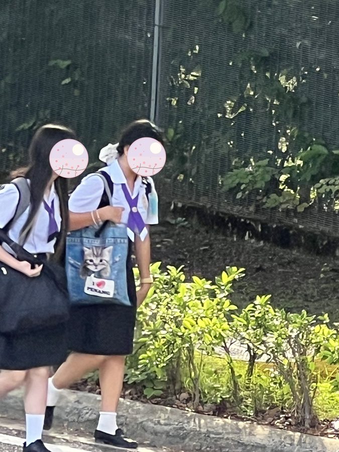 Walking in with a friend.