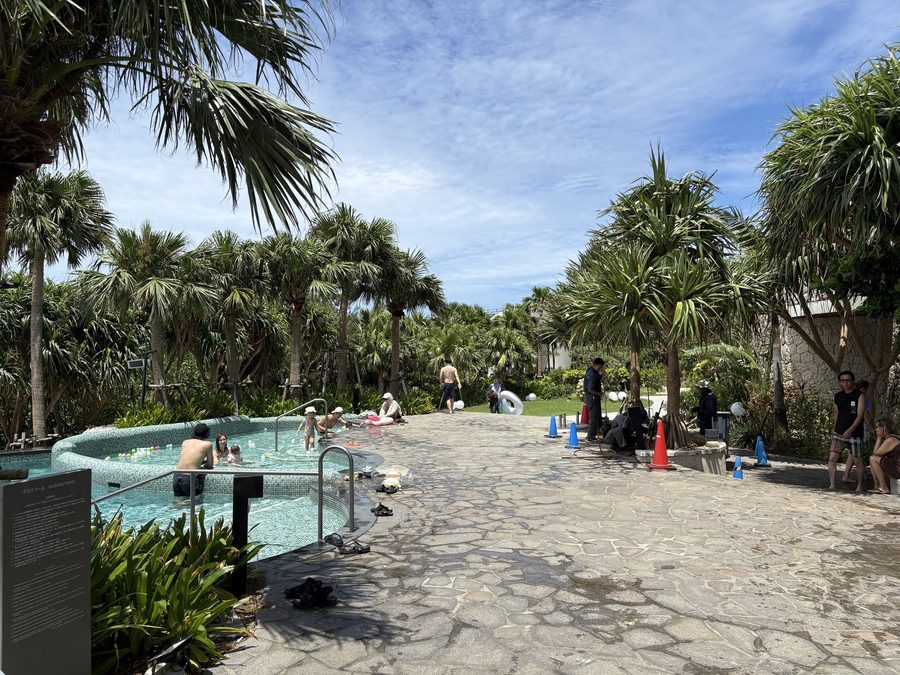 A small round pool for little kids, with balls floating in it
