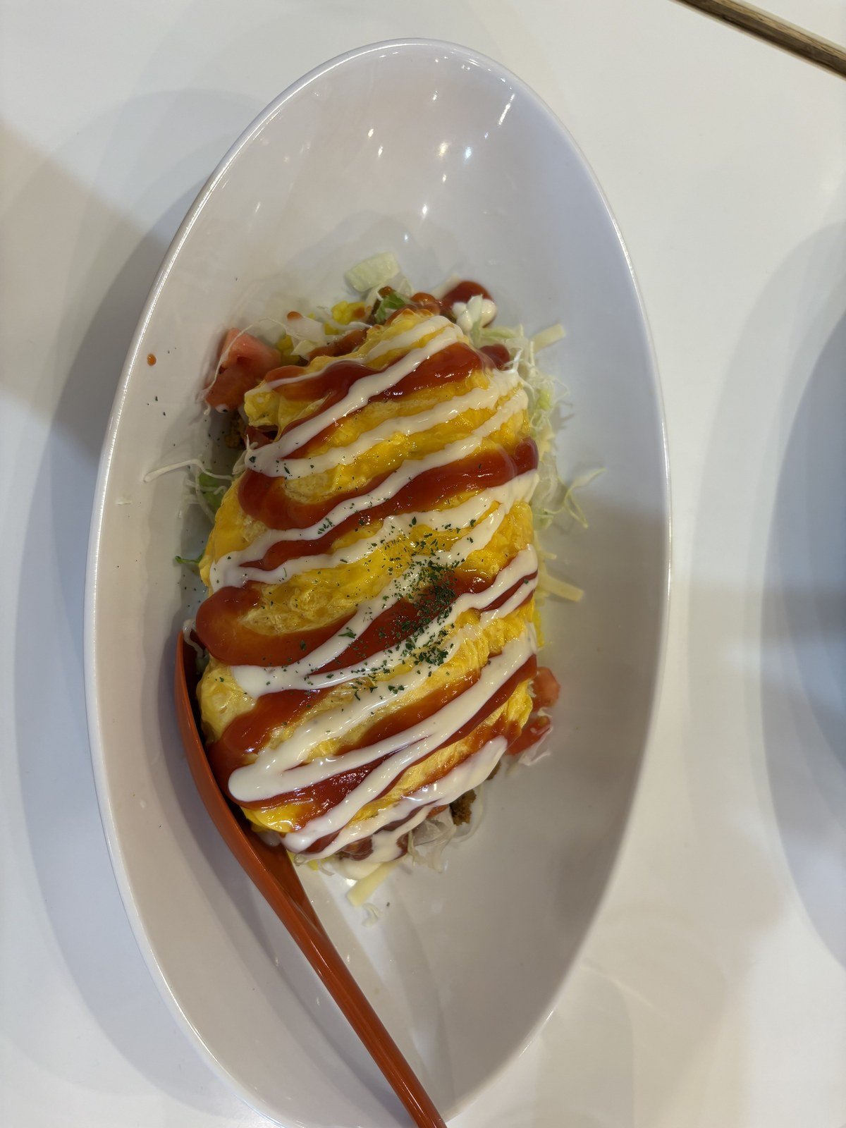 Omutaco. The yellow of the egg and the red of the sauce do a lot of the work