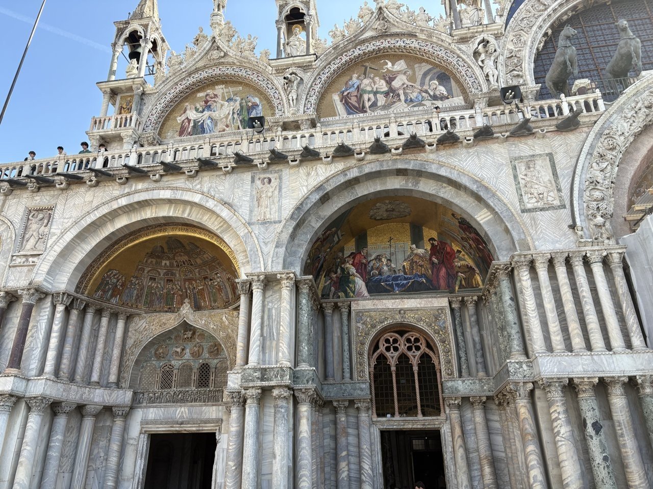 The golden mosaics and marble of St. Mark's Basilica façade — the star of the square
