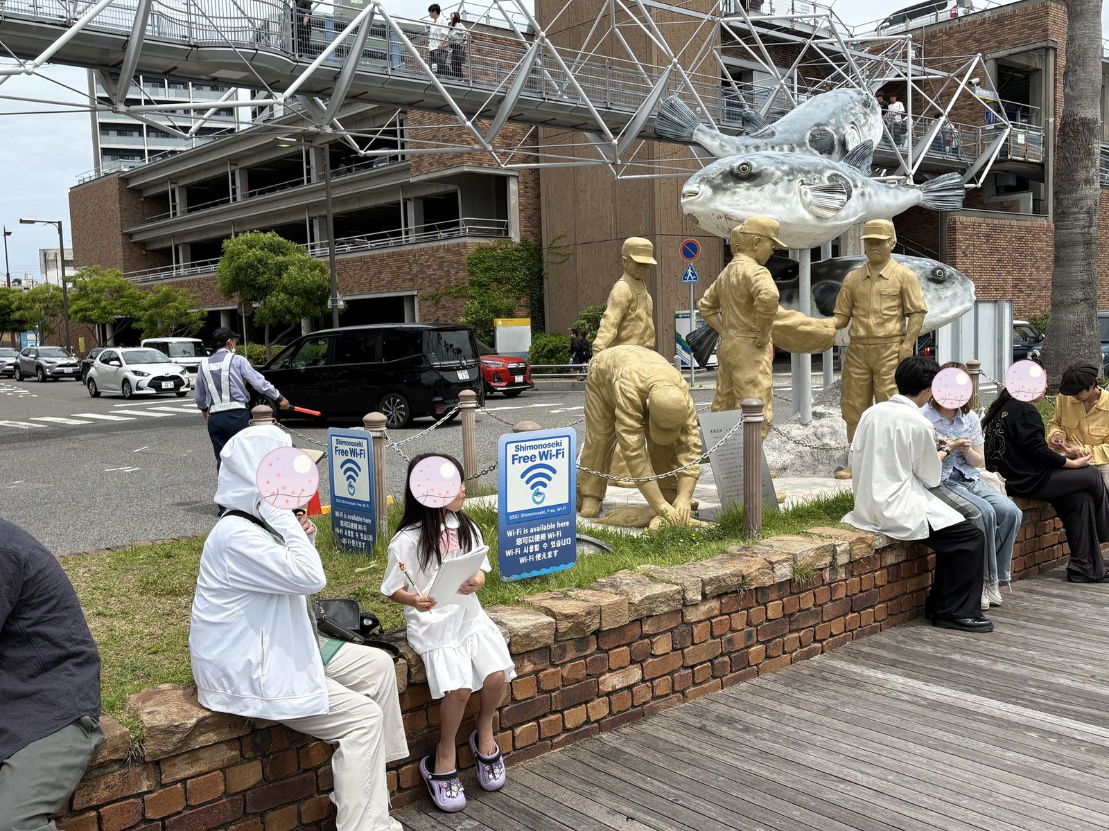 Taking a break in front of the fugu monument