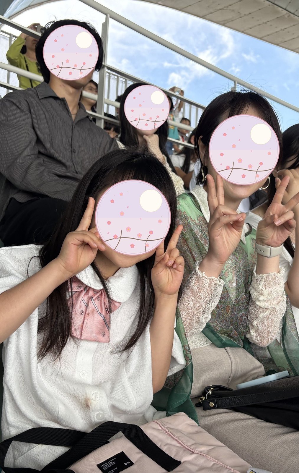 The family waiting in the stands for the dolphin show 